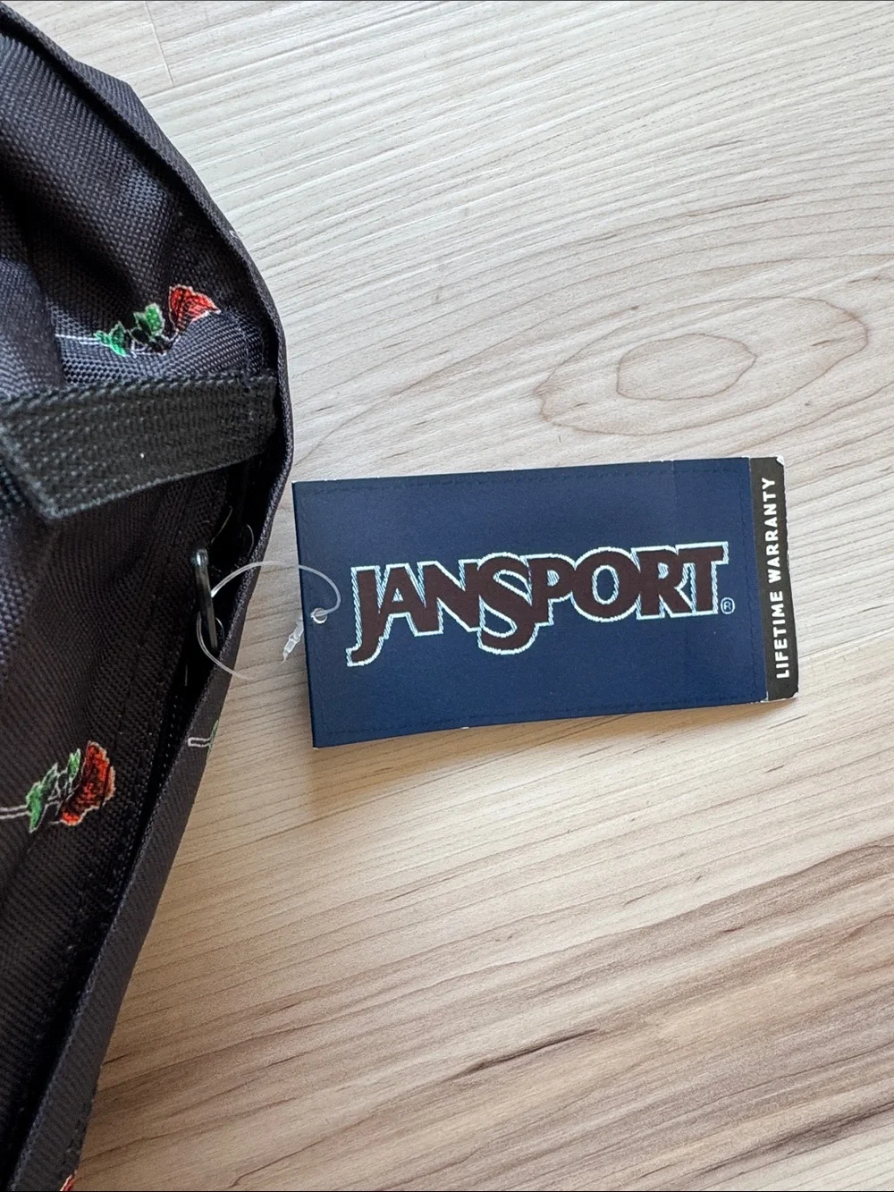 Jansport Black Backpack with Red Rose Print